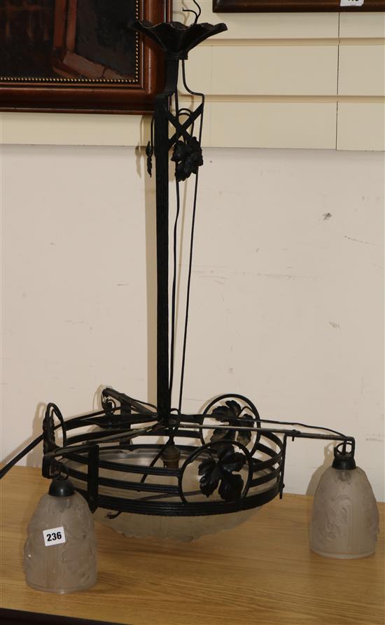 A French wrought iron and glass three branch electrolier